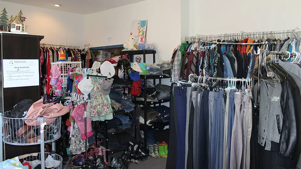 Photo of the Free Store showing clothing and various other items displayed